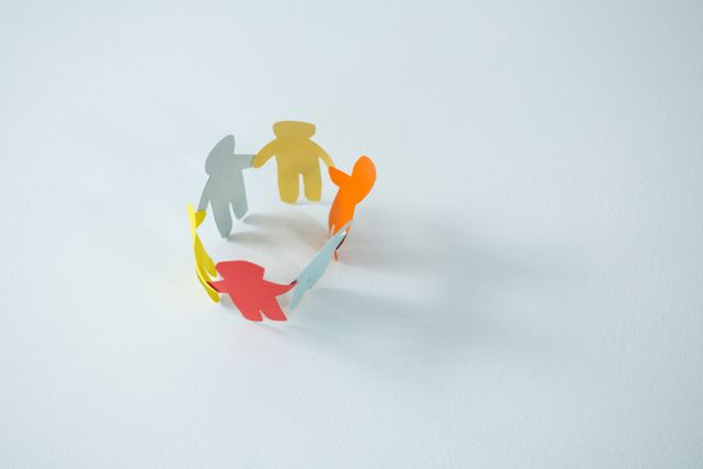 Circle of multicolored paper cut-out figures - Download Free Stock Photos Pikwizard.com