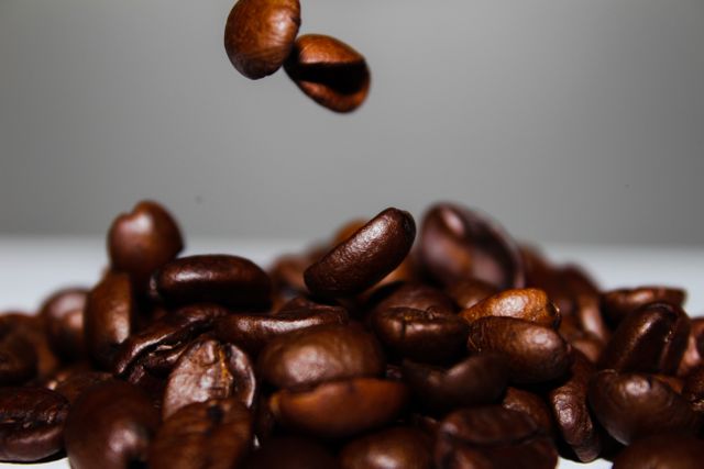Coffee slow motion falling coffee beans - Download Free Stock Photos Pikwizard.com