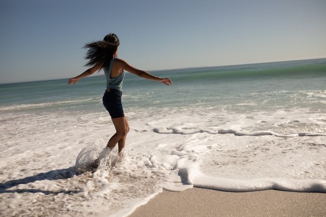 Woman having fun on beach - Download Free Stock Photos Pikwizard.com