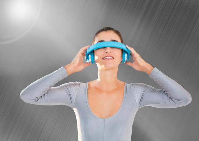 Digital composition of a woman using virtual reality headset against grey background