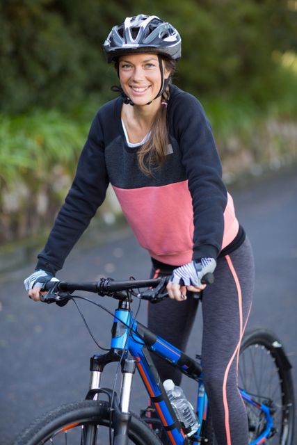 Female biker with mountain bike in countryside - Download Free Stock Photos Pikwizard.com