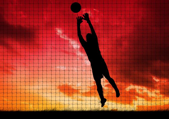 Silhouette of player catching a ball against net and sky in background - Download Free Stock Photos Pikwizard.com