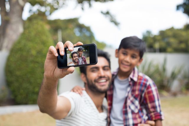 Happy father and son talking selfie - Download Free Stock Photos Pikwizard.com