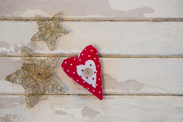 Christmas star and heart on wooden plank - Download Free Stock Photos Pikwizard.com