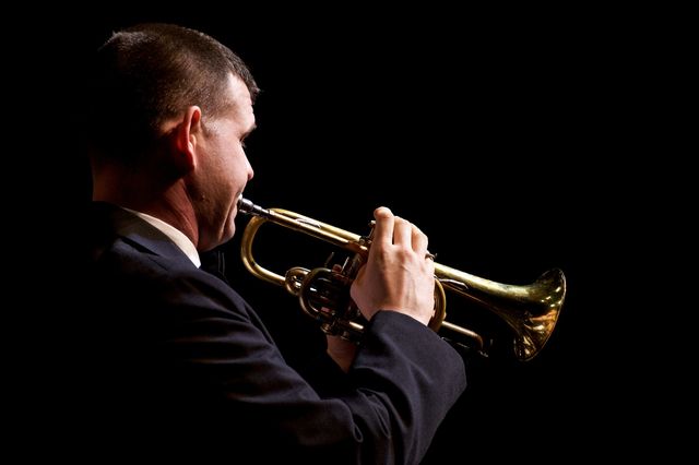 a man playing a trumpet - Download Free Stock Photos Pikwizard.com