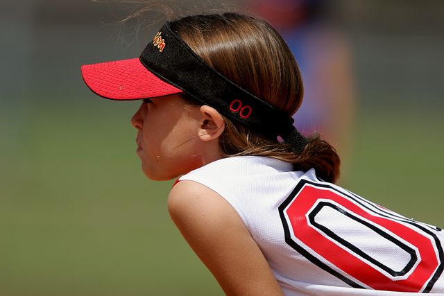 Girl Wearing Red and Black Sun Visor and White and Red Jersey Top - Download Free Stock Photos Pikwizard.com