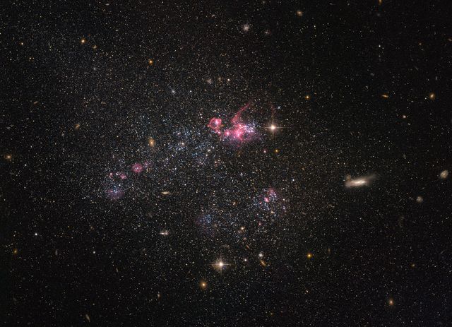 Hubble Peers at a Distinctly Disorganized Dwarf Galaxy - Download Free Stock Photos Pikwizard.com