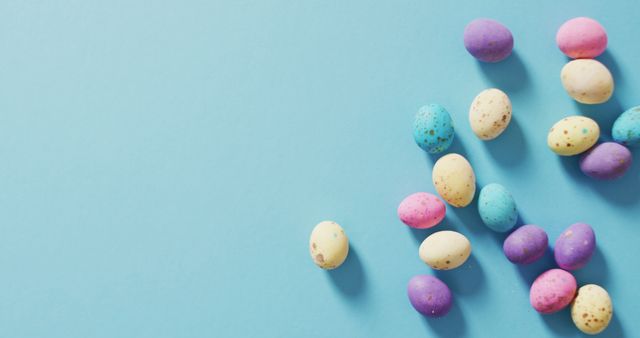Image of decorated colorful easter eggs on a blue surface - Download Free Stock Photos Pikwizard.com