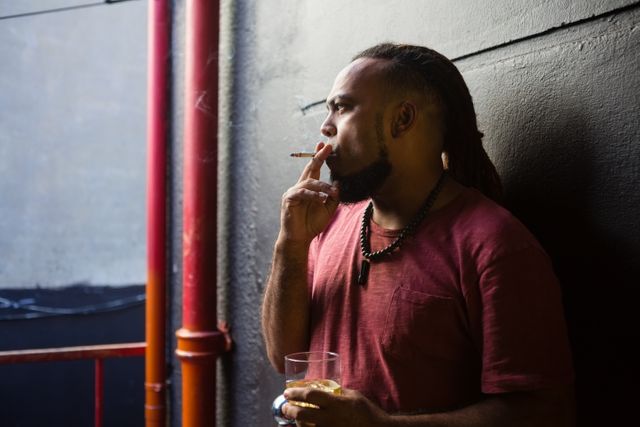Man smoking while having whisky - Download Free Stock Photos Pikwizard.com