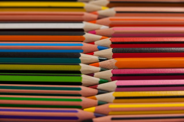 Colored pencils arranged in interlock pattern - Download Free Stock Photos Pikwizard.com
