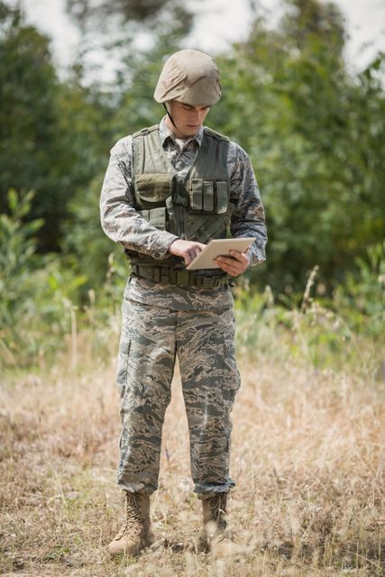 Military soldier using digital tablet - Download Free Stock Photos Pikwizard.com