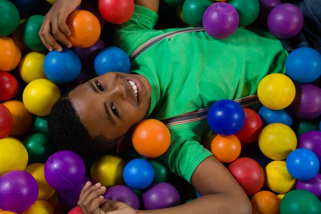 Overhead portrait of boy in ball pool - Download Free Stock Photos Pikwizard.com