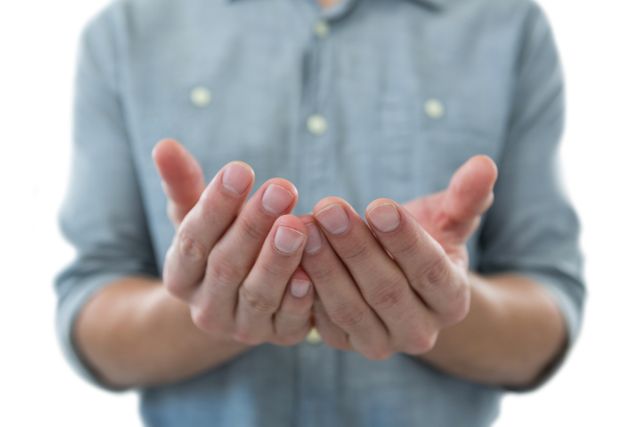 Cupped hands of man pretending to hold an invisible object - Download Free Stock Photos Pikwizard.com