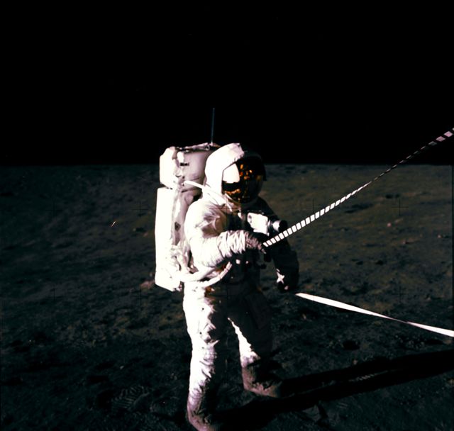 Astronaut Charles Conrad uses lunar equipment conveyer at Lunar Module - Download Free Stock Photos Pikwizard.com