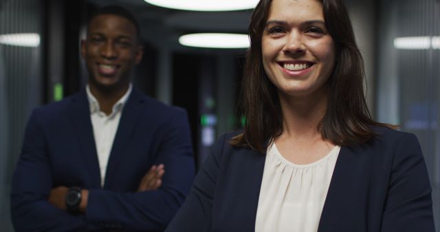 Portrait of smiling diverse businesswoman and businessman in modern office. business and business people in office concept.