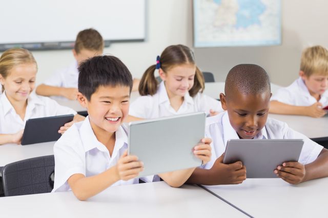 School kids using digital tablet in classroom - Download Free Stock Photos Pikwizard.com