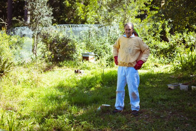 Caucasian senior man wearing beekeeper uniform looking at camera - Download Free Stock Photos Pikwizard.com