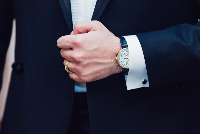 Mid section of businessmen wearing a watch. Business concept
