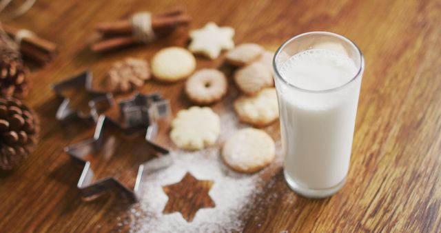 Image of christmas decorations with glass of milk and cookies on wooden background - Download Free Stock Photos Pikwizard.com