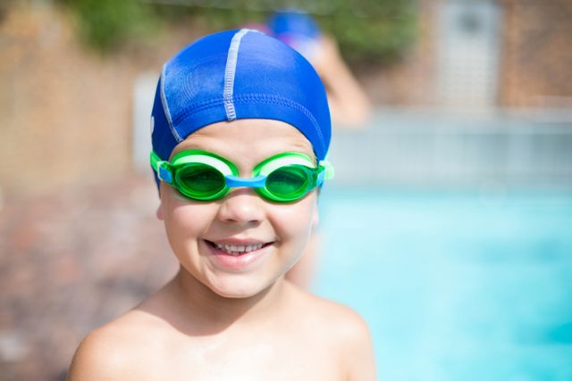 Little boy wearing swimming goggle and cap- Download Free Stock Photos Pikwizard.com