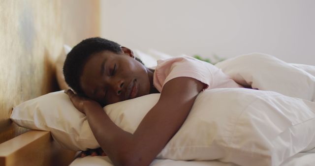 African american woman sleeping and wearing white pyjamas in her bedroom - Download Free Stock Photos Pikwizard.com