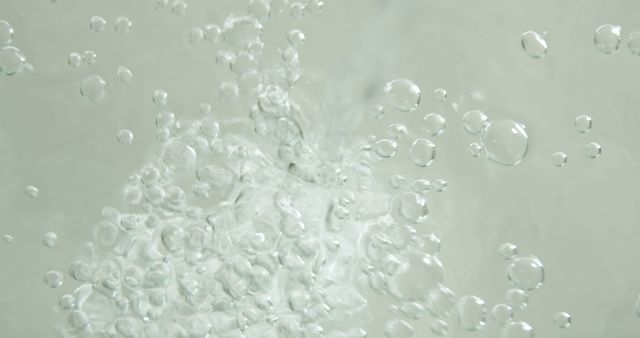 Bubbles form vigorously in clear water, indicating movement or a reaction taking place - Download Free Stock Photos Pikwizard.com