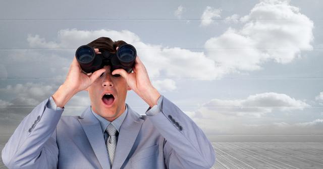 Shocked businessman looking through binoculars - Download Free Stock Photos Pikwizard.com
