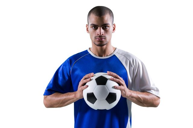 Portrait of football player holding football with both hands - Download Free Stock Photos Pikwizard.com