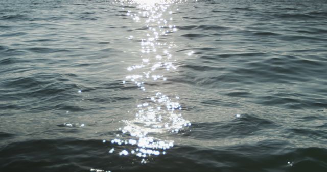 Sunlight reflected on rippled pattern of calm blue ocean - Download Free Stock Photos Pikwizard.com