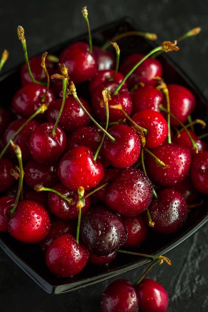 A handful of cherries berry cherry closeup - Download Free Stock Photos Pikwizard.com