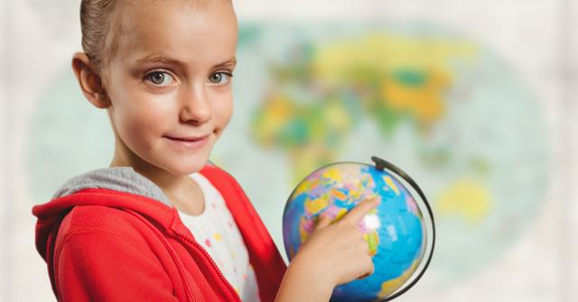 Girl with globe against blurry map - Download Free Stock Photos Pikwizard.com