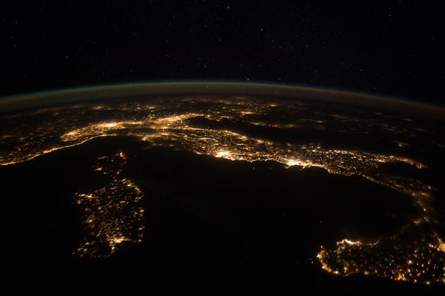 ISS030-E-074752 (25 Jan. 2012 ) --- This nighttime panorama of much of Europe was photographed by one of the Expedition 30 crew members aboard the International Space Station flying approximately 240 miles above the Tyrrhenian Sea on Jan. 25, 2012. Most of the country of Italy is visible running horizontally across the center of the frame, with the night lights of Rome and Naples being visible to the center and right center, respectively.  Sardinia, and Corsica  are in the lower left quadrant of the photo, and Sicily is at lower right corner. The Adriatic Sea is on the other side of Italy, and beyond it to the east and north can be seen parts of several other European nations.