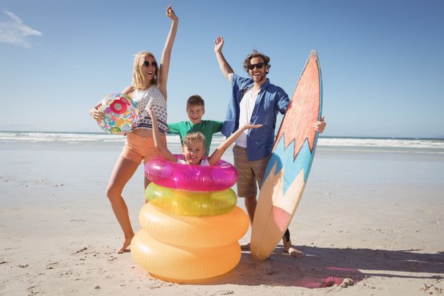 Cheerful family with arms raised at beach - Download Free Stock Photos Pikwizard.com