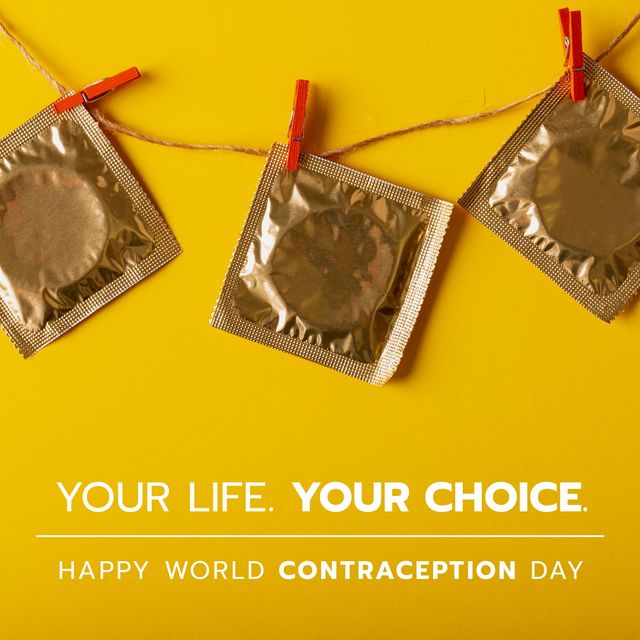 Condom packs hanging on clothesline and your life, your choice, happy world contraception day text. Composite, sexual, pregnancy, birth control, awareness, healthcare, campaign, protection, yellow.
