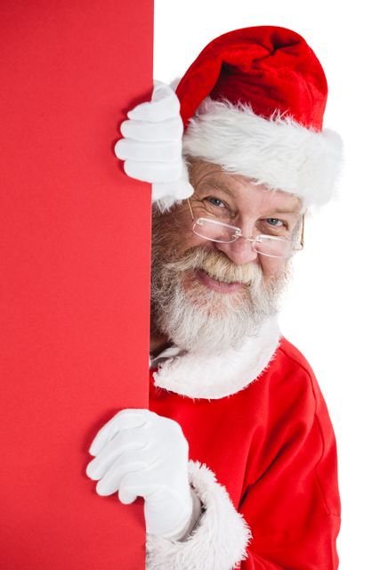 Santa claus peeking from red board - Download Free Stock Photos Pikwizard.com