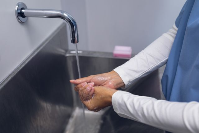 Female surgeon washing hands on sink in hospital - Download Free Stock Photos Pikwizard.com