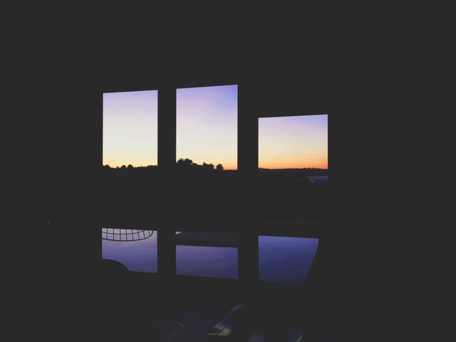 View of sunset sky through the house window. nature and ecology concept