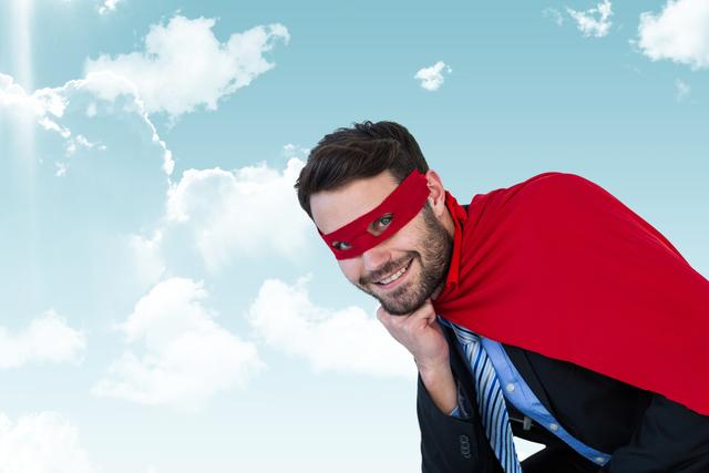 Businessman wearing super hero costume in sky - Download Free Stock Photos Pikwizard.com