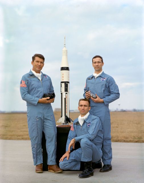 three men posing with a rocket - Download Free Stock Photos Pikwizard.com