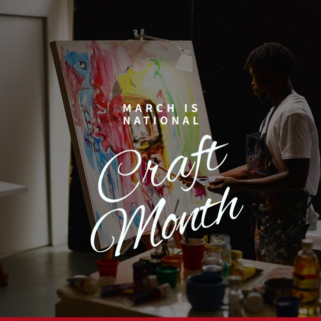 Composition of march is national craft month text over african american man painting in workshop. National craft month, craftsmanship and small business concept.