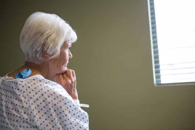 Senior patient standing at hospital - Download Free Stock Photos Pikwizard.com