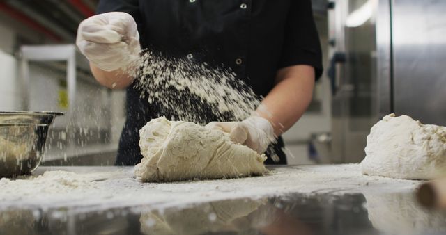 Midsection of caucasian female chef wearing rubber gloves and preparing dough - Download Free Stock Photos Pikwizard.com