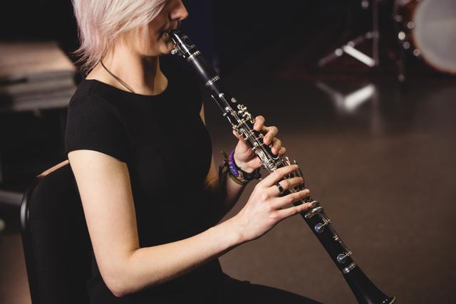 Female student playing clarinet - Download Free Stock Photos Pikwizard.com