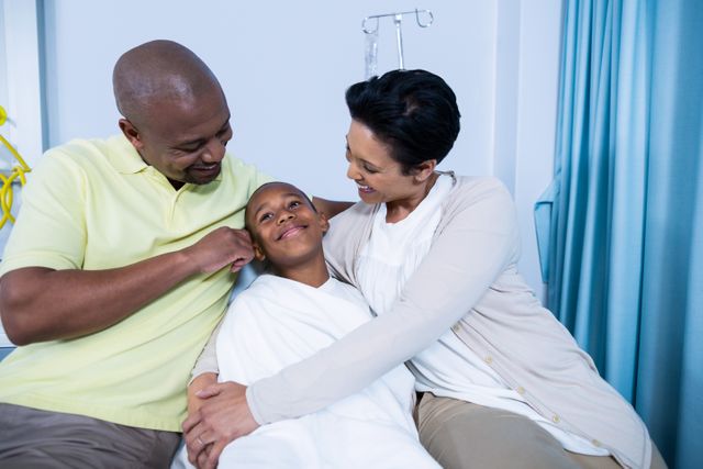 Smiling parents interacting with patient - Download Free Stock Photos Pikwizard.com