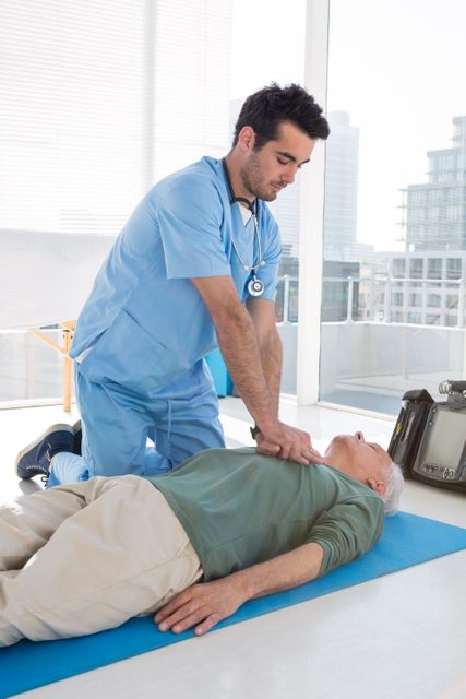 Doctor performing resuscitation on patient - Download Free Stock Photos Pikwizard.com