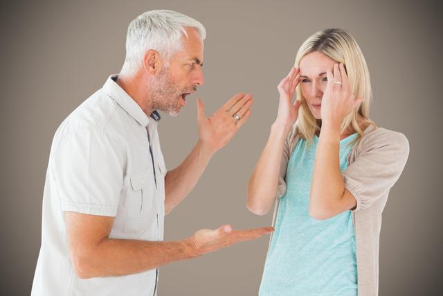 Senior man arguing with woman against gray background - Download Free Stock Photos Pikwizard.com