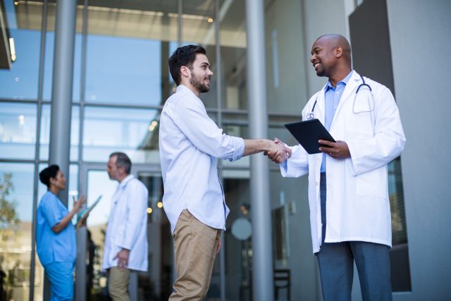 Doctor and patient shaking hands - Download Free Stock Photos Pikwizard.com