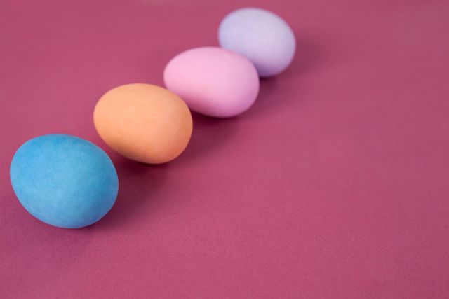 Easter eggs arranged on pink background - Download Free Stock Photos Pikwizard.com