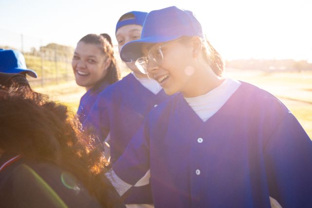 Diverse group of female baseball players motivating themselves before the game - Download Free Stock Photos Pikwizard.com
