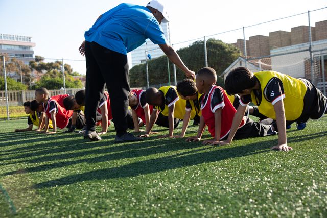 Multi-ethnic children soccer team practicing - Download Free Stock Photos Pikwizard.com